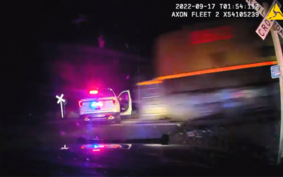 Colorado Police Officer Parks Cruiser Across Train Tracks with a Woman Inside & Gets Her Hit by the Train